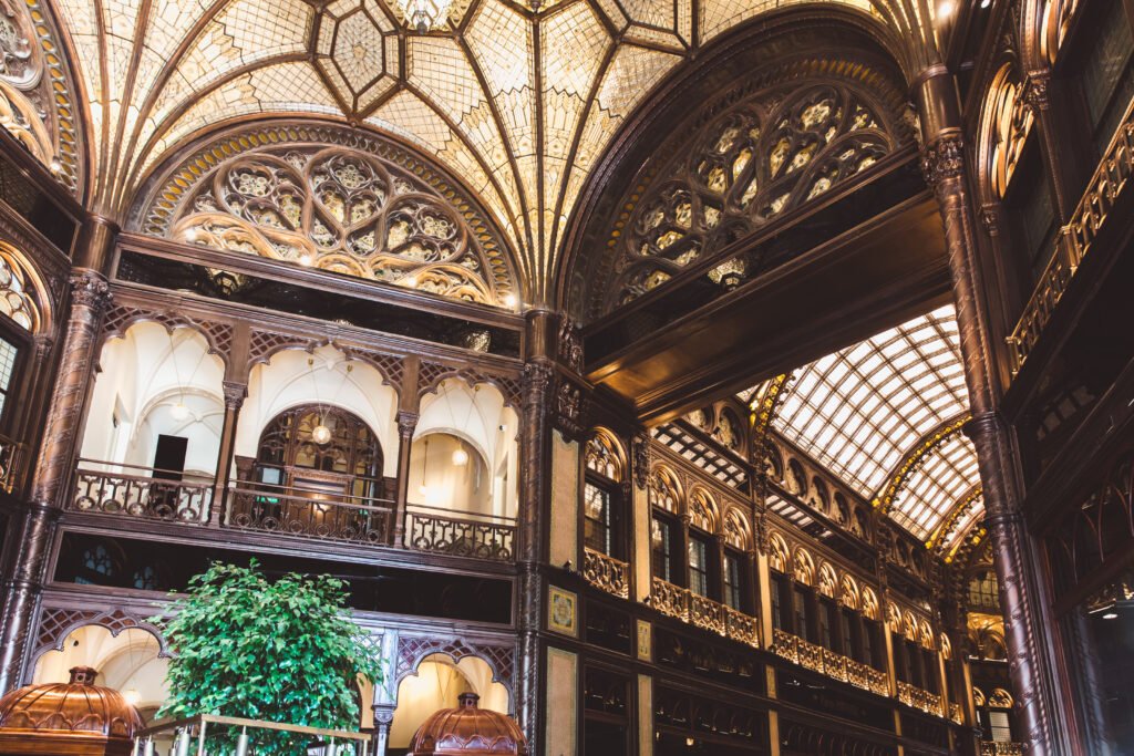 Art Nouveau interior of Párisi Udvar in Budapest with ornate arches and glass detailing