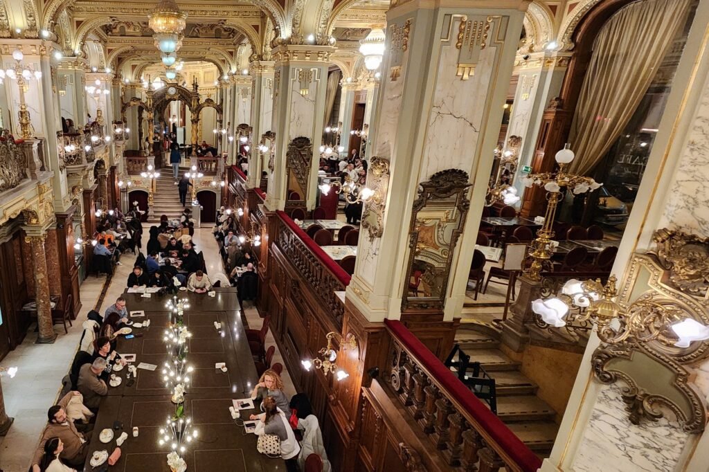 Grand staircase and gilded historic interior of New York Café in Budapest