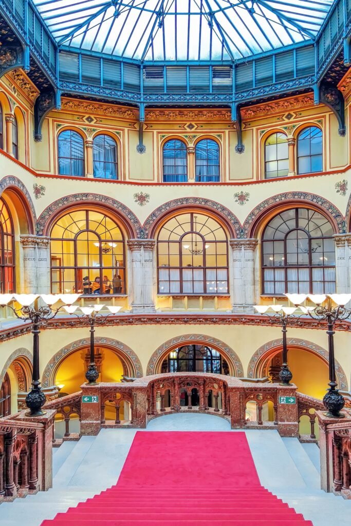 Ornate historic staircase inside Palais Ferstel in Vienna Austria