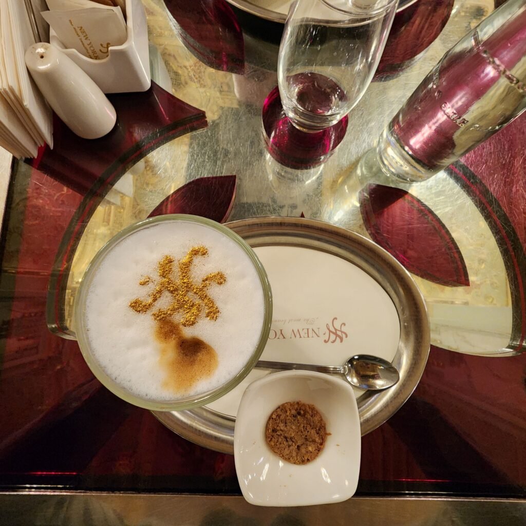 Cappuccino served on an elegant tray at New York Café in Budapest