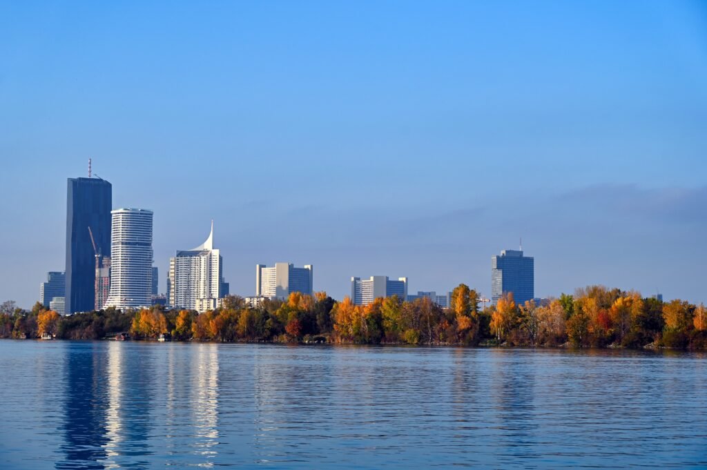 Blue Danube River and Vienna cityscape in Austria during autumn