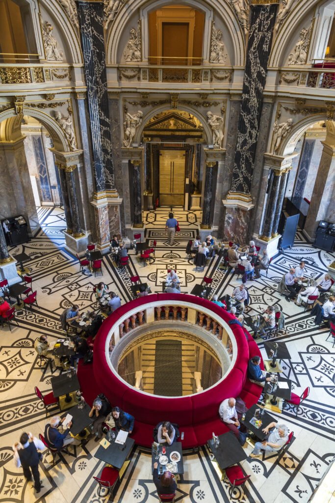 Ornate café interior inside Vienna's Kunsthistorisches Museum with marble columns and historic architectural details