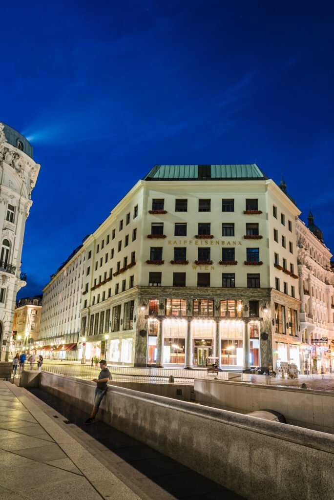 Evening street scene at Michaelerplatz in Vienna with Adolf Loos's modernist Looshaus